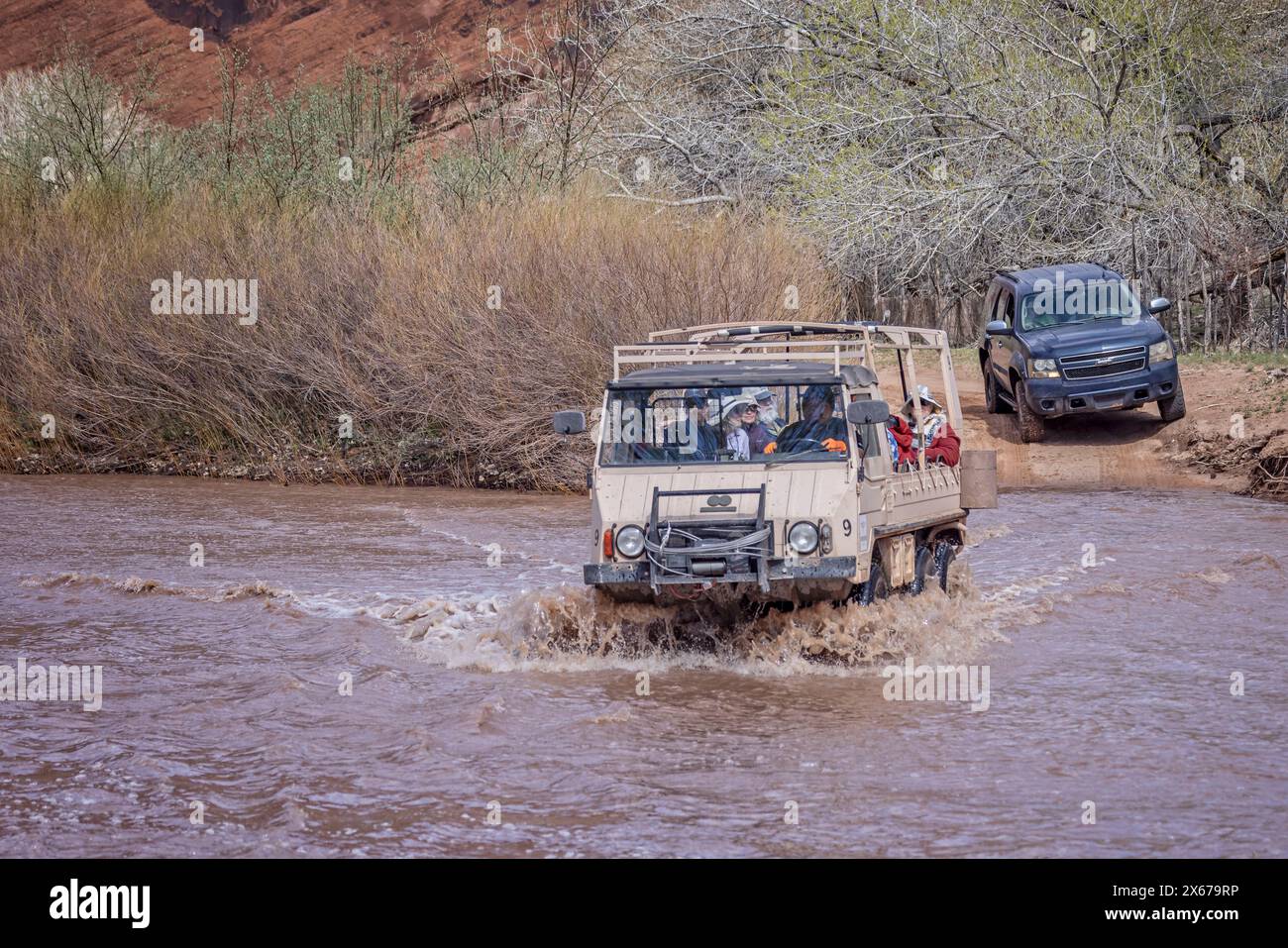 Pinzgauer off road vehicle splashing through meltwater river on tour of the canyon floor of Canyon de Chelly National Monument in Arizona, USA on 19 A Stock Photo