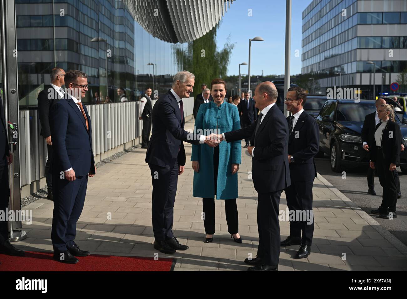Stockholm, Sweden. 13th May, 2024. STOCKHOLM, SWEDEN 20240513Norway's Prime Minister Jonas Gahr Støre shakes hands with Germany's Chancellor Olaf Scholz as he is welcomed by the Nordic prime ministers outside Ericssonheadquarters in Kista, Stockholm, Sweden, May 13, 2024, during a two-day Nordic Prime Minister's meeting, on security and competitiveness. On the left is Finland's Prime Minister Petteri Orpo, in the middle is Denmark's Mette Fredriksen and on the right is Sweden's Prime Minister Ulf Kristersson (M). Photo: Pontus Lundahl/TT/Code 10050 Credit: TT News Agency/Alamy Live News Stock Photo