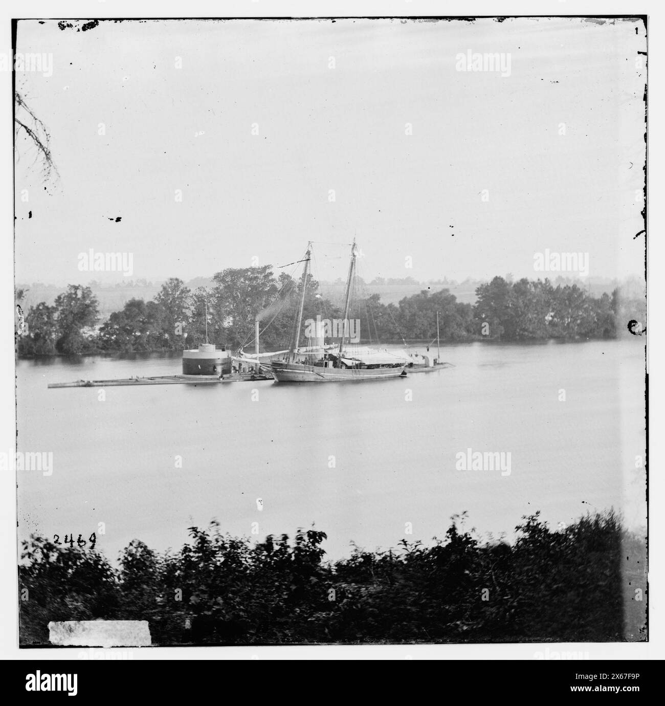 James River, Virginia. U.S. monitor CANONICUS taking on coal from a ...