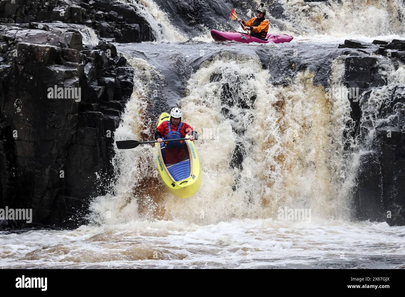 Canoeist and kayaker descending Low Force on the River Tees, Upper Teesdale, County Durham, UK Stock Photo