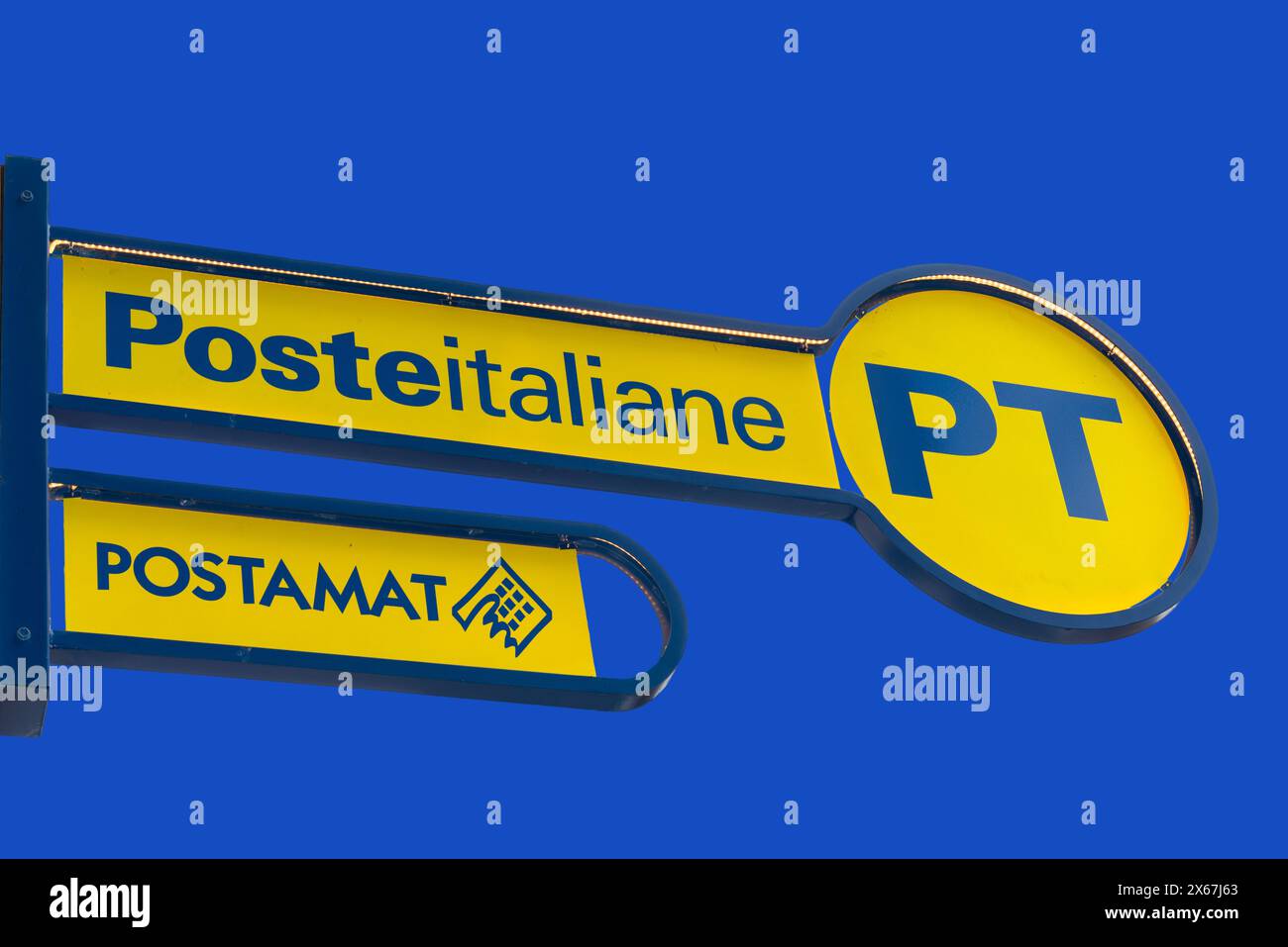 Italy - May 09, 2024: PT Poste Italiane, Italy Post logo and Postman logo on yellow sign on blue sky, outside the Italian post office. Tex: Posteitali Stock Photo