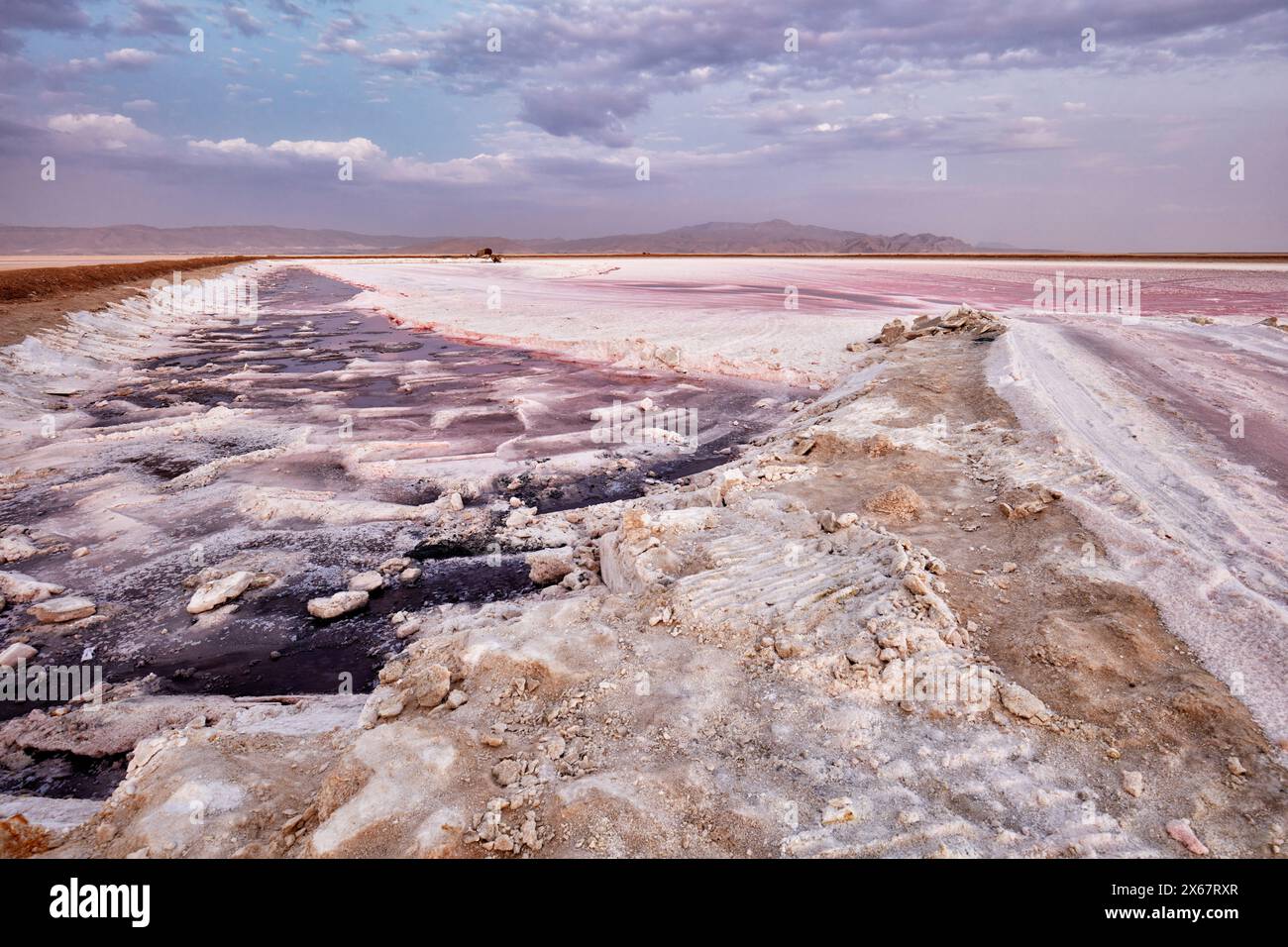 Dry bed of the Maharloo Lake, aka the Pink Lake, seasonal potassium rich salt lake, in winter season. Fars Province, Iran. Stock Photo