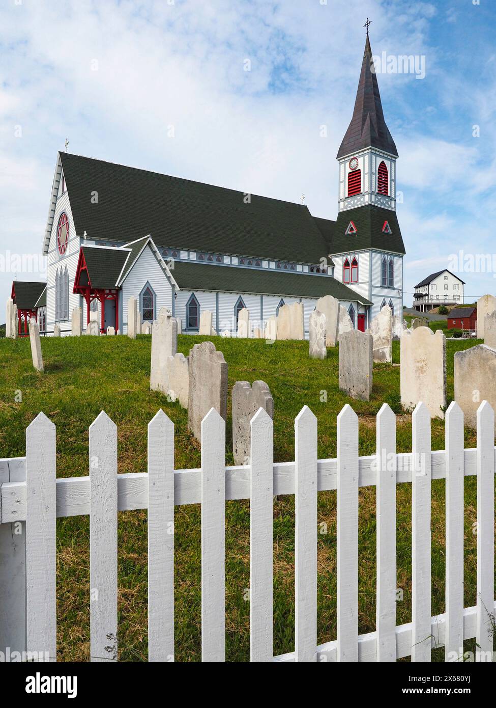 Canada, cemetery, completed 1894, fishing community, Gothic Revival architecture, Heritage Foundation of Newfoundland and Labrador designated St. Paul's Anglican Church a Registered Heritage Structure, historic, Newfoundland, North America, Protestant religion, religious site, St. Paul's Anglican Church, town of Trinity, Trinity Bight, wood Stock Photo