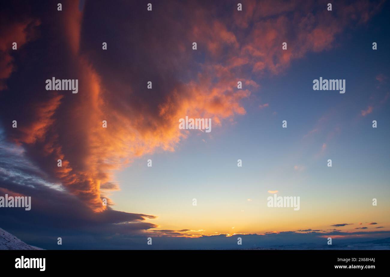 sunset colors making clouds look like a fire in the sky Stock Photo - Alamy