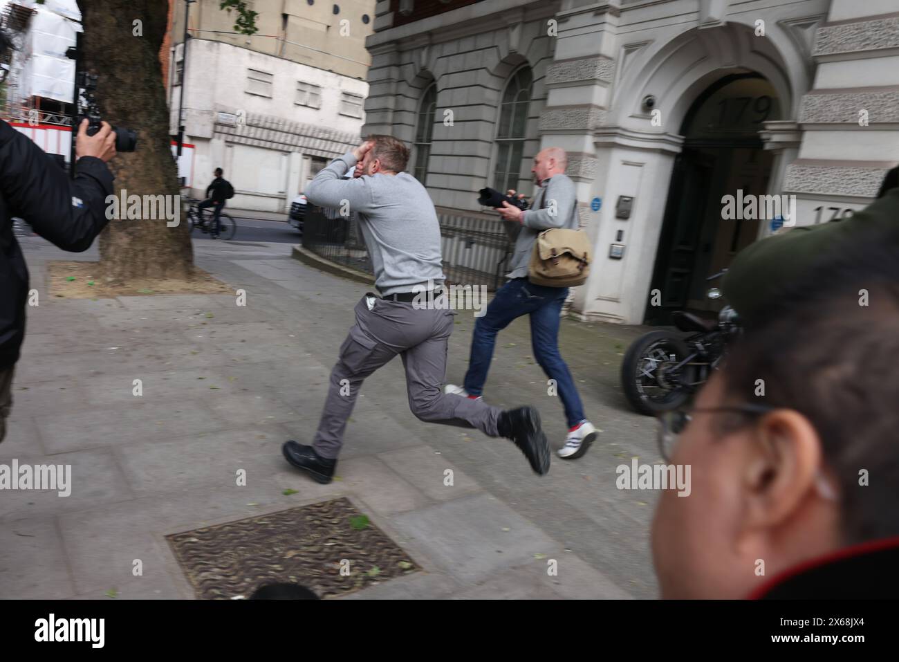 Westminster, London, UK. 13th May, 2024. Defendant Matthew Trickett, 37, of Maidenhead, Berkshire, dashed out of Westminster Magistrates Court after being granted bail over his National Security Act charge over assisting the Hong Kong intelligence service. Credit: Shing Hei Yip/Alamy Live News Stock Photo