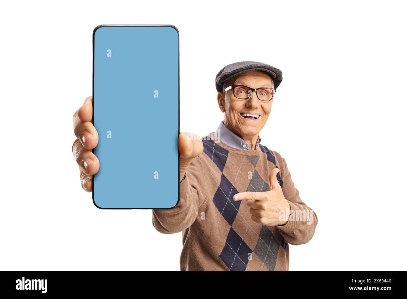 Senior man showing a smartphone with blue screen in front of camera isolated on white background Stock Photo