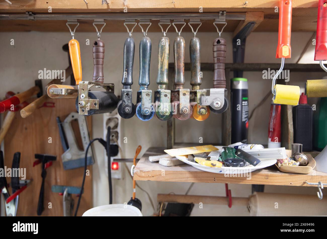 Artist studio, workshop, artist tools, paints, rollers Stock Photo