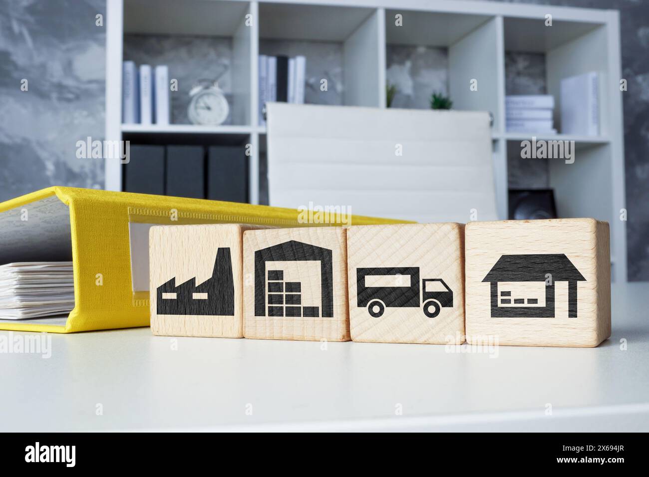 Folder and cubes with supply chain management SCM and Logistics stages. Stock Photo