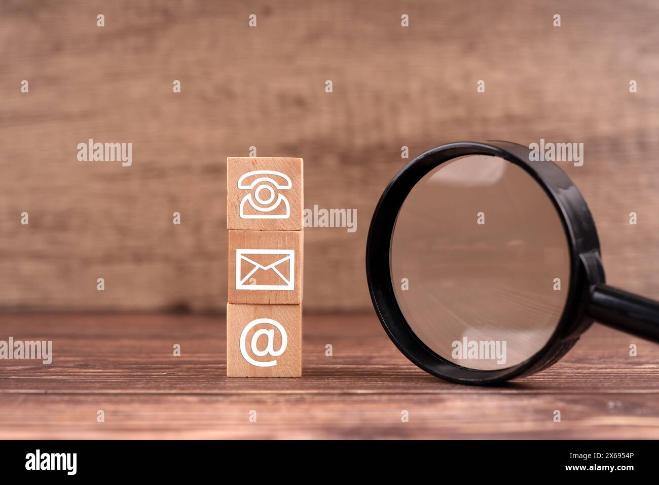 Contact Us symbol and magnifying glass business concept Stock Photo