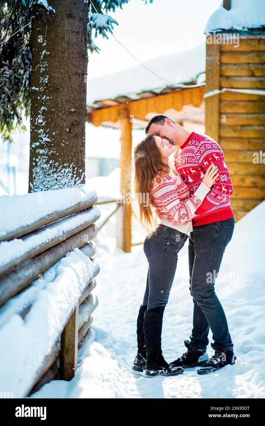 Engagement session love story of a young straight couple hugging and