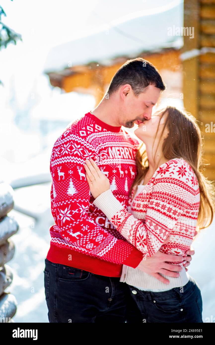 Engagement session love story of a young straight couple hugging and