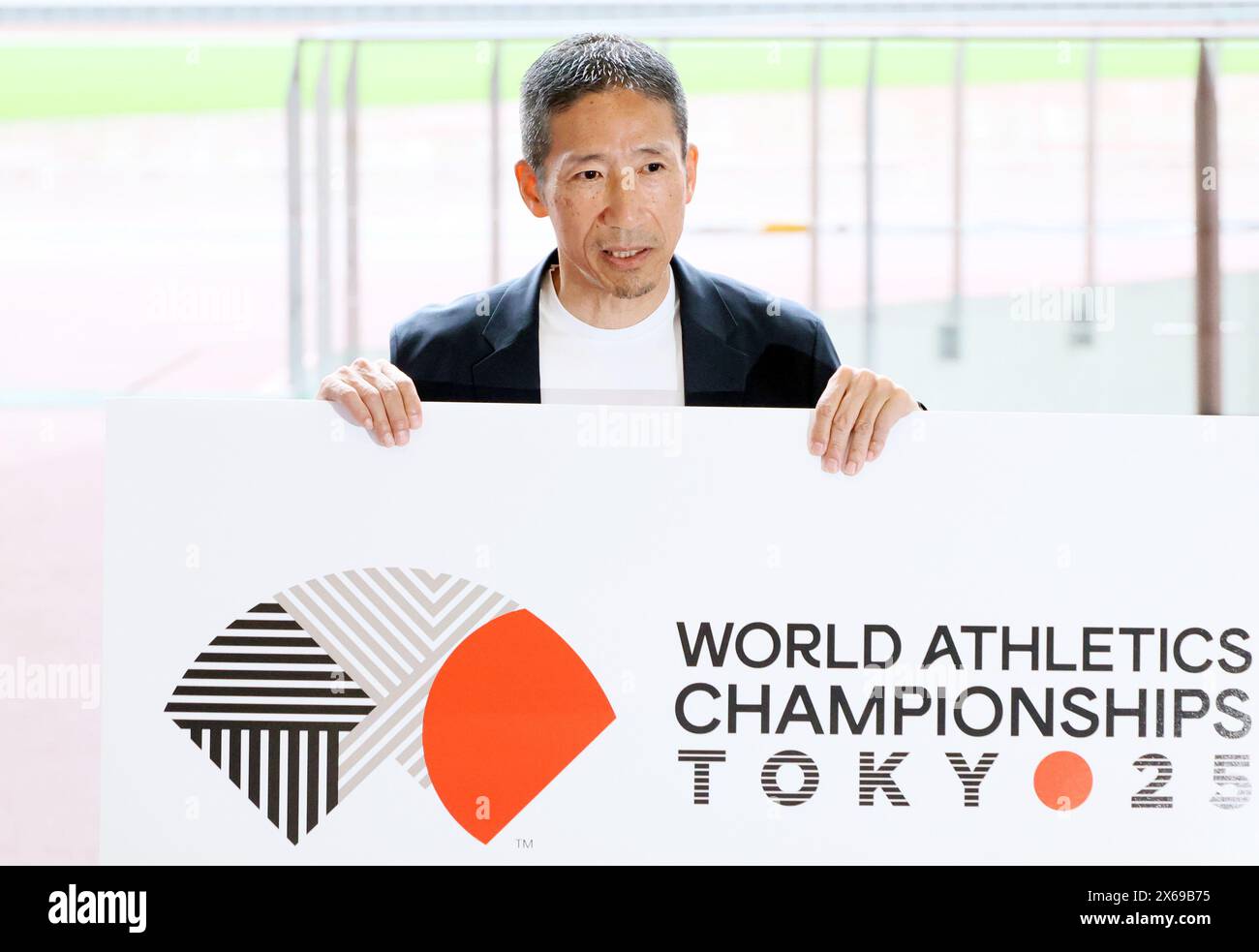 Tokyo, Japan. 13th May, 2024. Japanese designer Ryo Nakagawa displays the logo mark of World