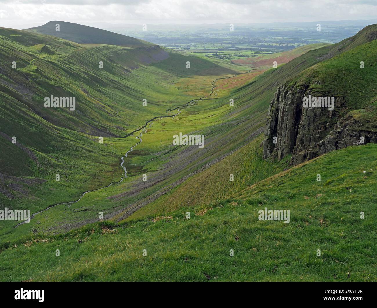 view of spectacular iconic steep-sided geological glacial valley of High Cup Nick with winding silver stream in Northern Pennines Cumbria, England, UK Stock Photo