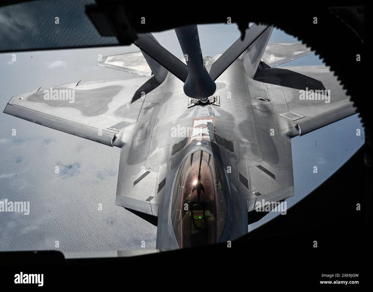 Savannah, United States. 09 May, 2024. A U.S. Air Force F-22 Raptor fighter aircraft assigned to the 1st Fighter Wing, refuels from a KC-135 Stratotanker aircraft during exercise Sentry Savannah, May 9, 2024, over Savannah, Georgia.  Credit: MSgt. Morgan Whitehouse/U.S Air Force/Alamy Live News Stock Photo