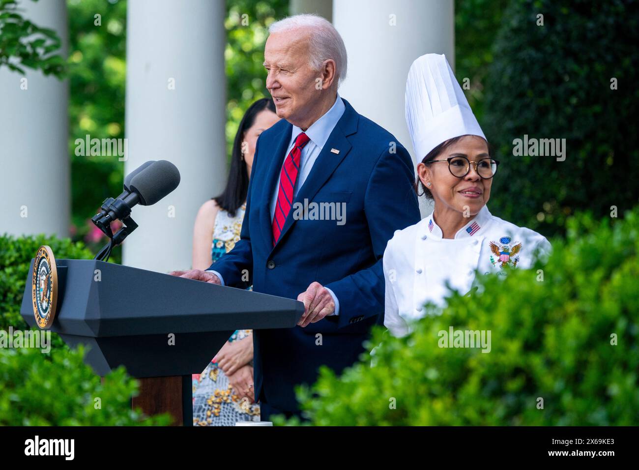 Washington, United States. 13th May, 2024. US President Joe Biden, with White House Chef Cristeta Comerford, delivers remarks during a reception celebrating Asian American, Native Hawaiian, and Pacific Islander Heritage Month in the Rose Garden the White House in Washington, DC, USA, 13 May 2024. Credit: Abaca Press/Alamy Live News Stock Photo