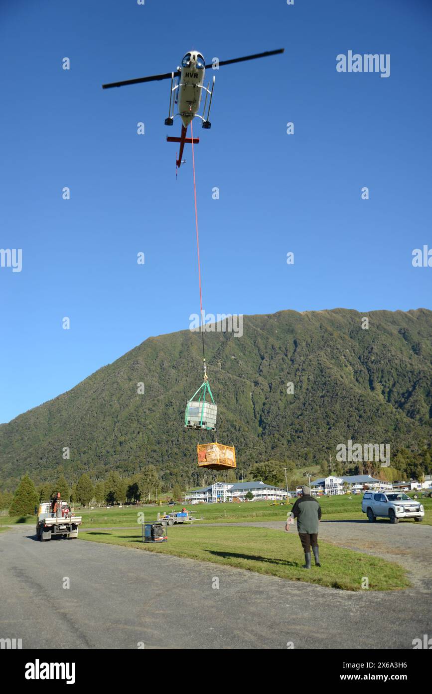 GREYMOUTH, NEW ZEALAND, May 7, 2024 A helicopter carrying a load of