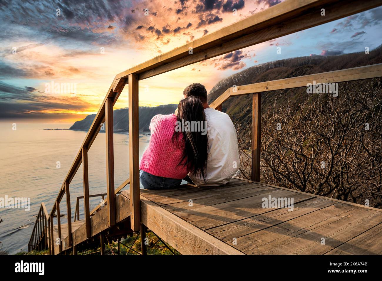 Two people sitting on stairs hi-res stock photography and images - Alamy