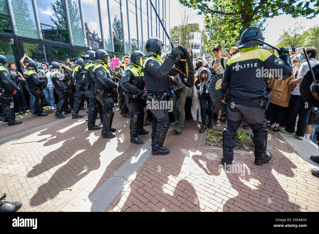 Piersonstraat Riots Police officers use batons with force to disperse student protesters ...