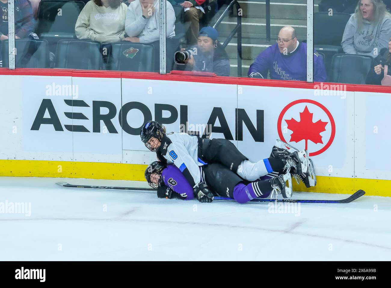 St. Paul, Minnesota, USA. 13th May, 2024. Minnesota Forward KENDALL COYNE SCHOFIELD (26) gets tripped by Toronto Forward JESSE COMPHER (18) during game 3 of the inaugural PWHL Playoffs Semi-Final round between Minnesota and Toronto at Xcel Energy Center in St. Paul. Minnesota won 2-0. Toronto leads the series 2-1. (Credit Image: © Steven Garcia/ZUMA Press Wire) EDITORIAL USAGE ONLY! Not for Commercial USAGE! Stock Photo