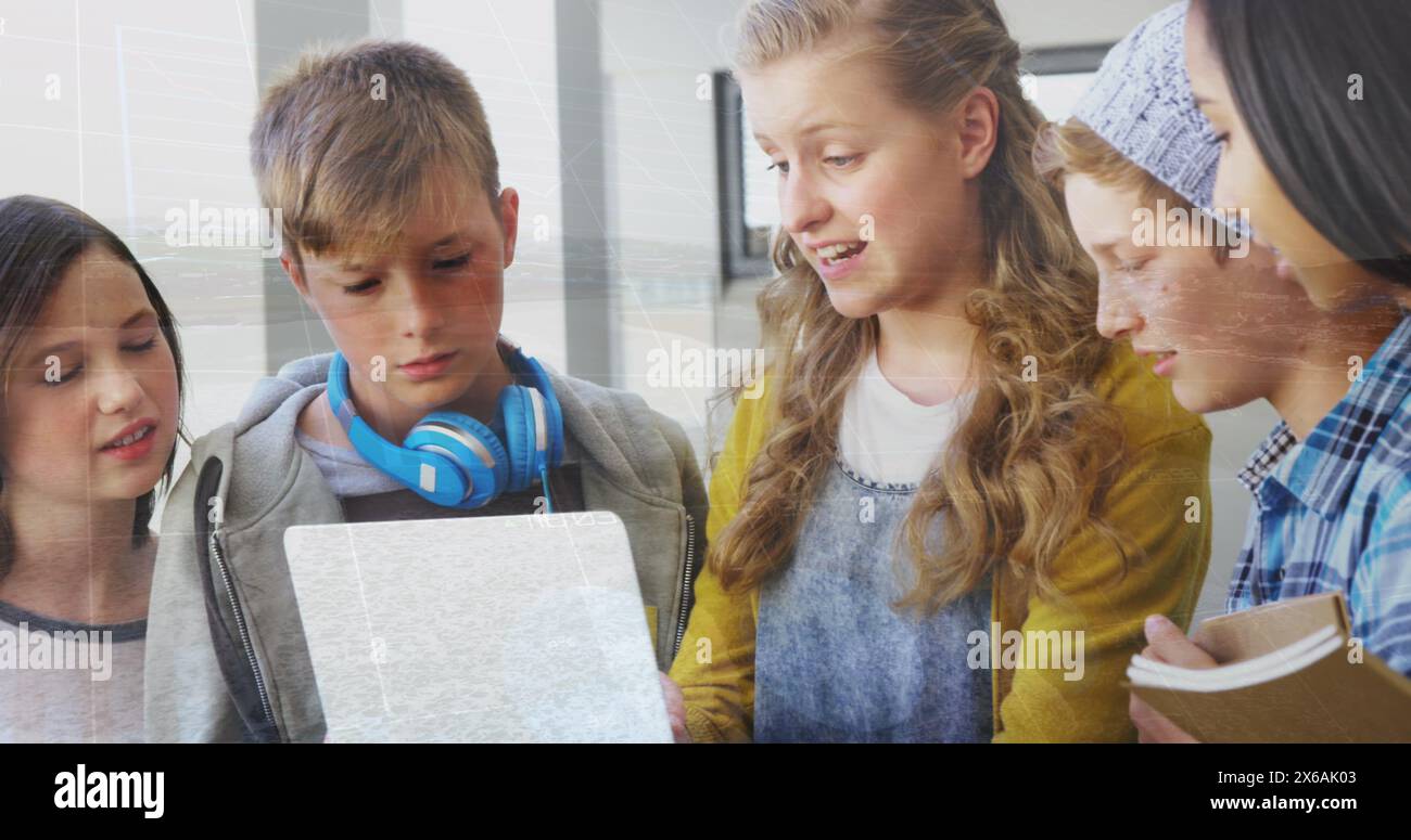Image of data processing over group of diverse students using laptop at school Stock Photo