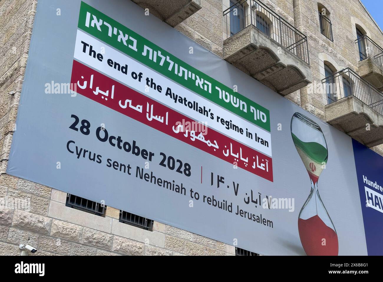 JERUSALEM - MAY 6: A billboard funded by an Evangelical group on the building housing The Friends of Zion FOZ Museum which celebrates Christian Zionists and their contribution to Israel, predicts Iran's Ayatollah-led government will fall by October 28, 2028. The statement displays an hourglass depicting the regime's decline on May 6, 2024 in Jerusalem. Kamal Kharrazi, an adviser to Iran's Supreme Leader Ayatollah Ali Khamenei, warned Tehran would rethink its nuclear doctrine if Israel threatens its existence amid West Asian upheaval after the Gaza war. Stock Photo