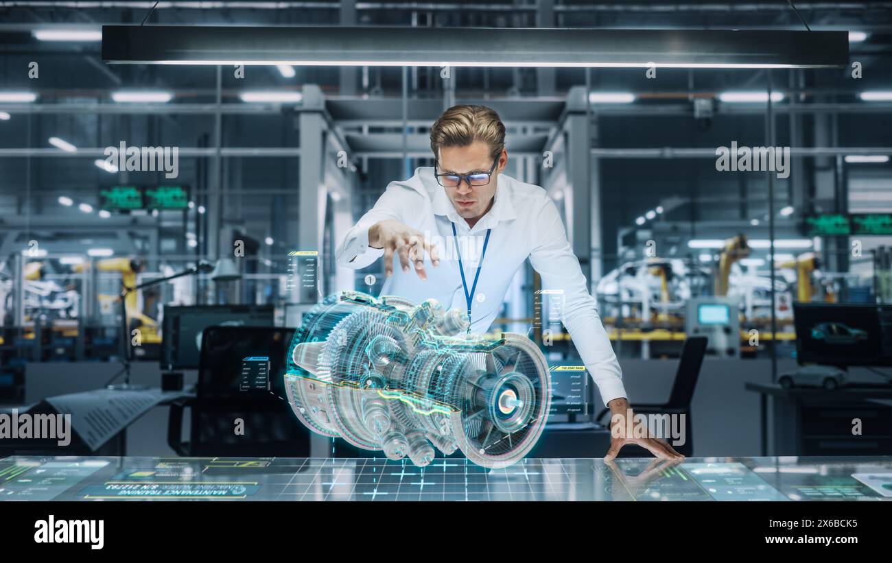 Confident Engineer in White Shirt Working on Jet Engine with Use of Augmented Reality Hologram in an Office at Plane Assembly Plant. Industrial Specialist Working in Technological Development Facility Stock Photo