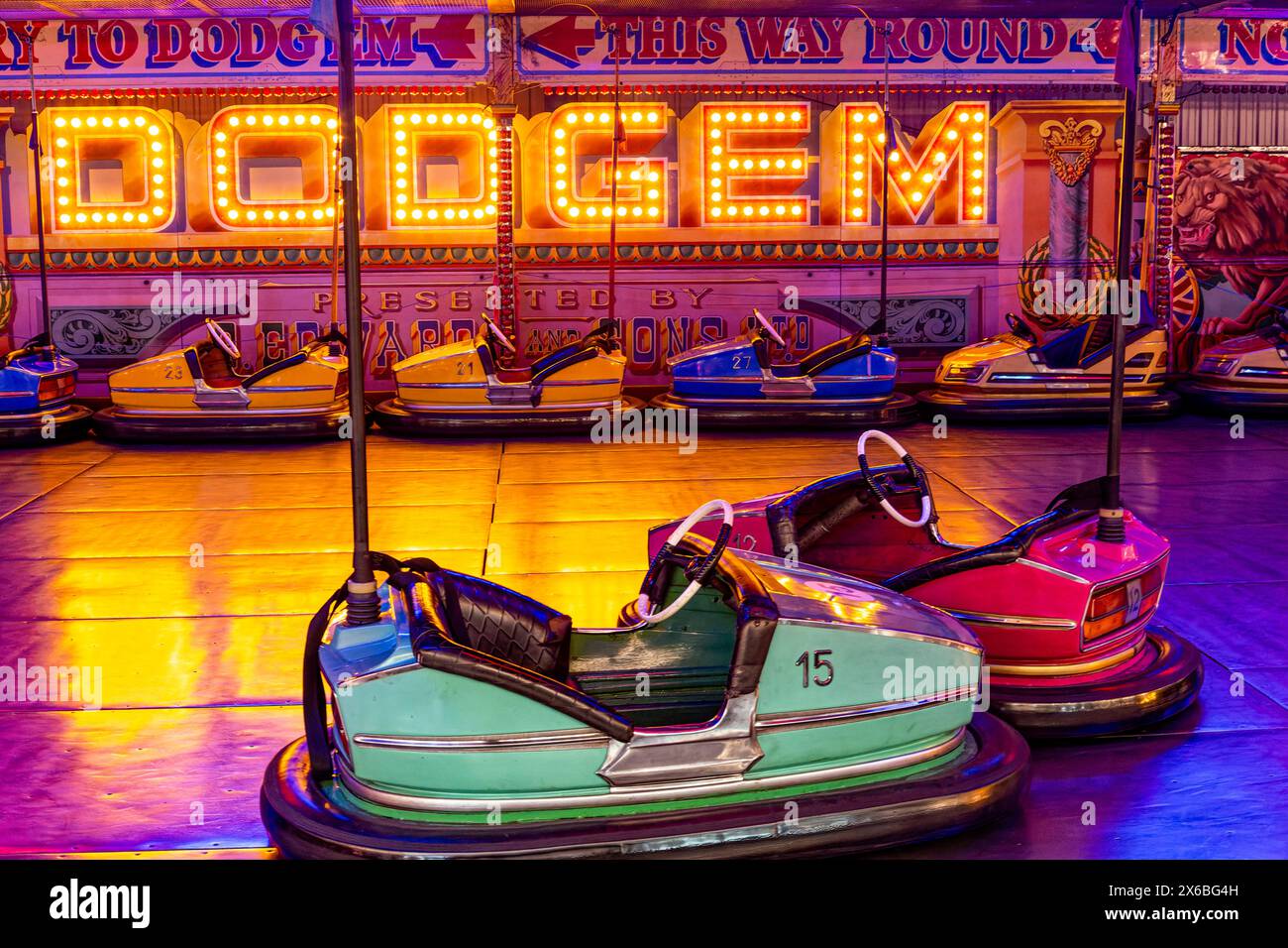 Vintage Dodgem Cars Parked Under Colourful Lights Waiting For Drivers Vintage Dodgem Cars Parked Under Colourful Lights Waiting For Drivers