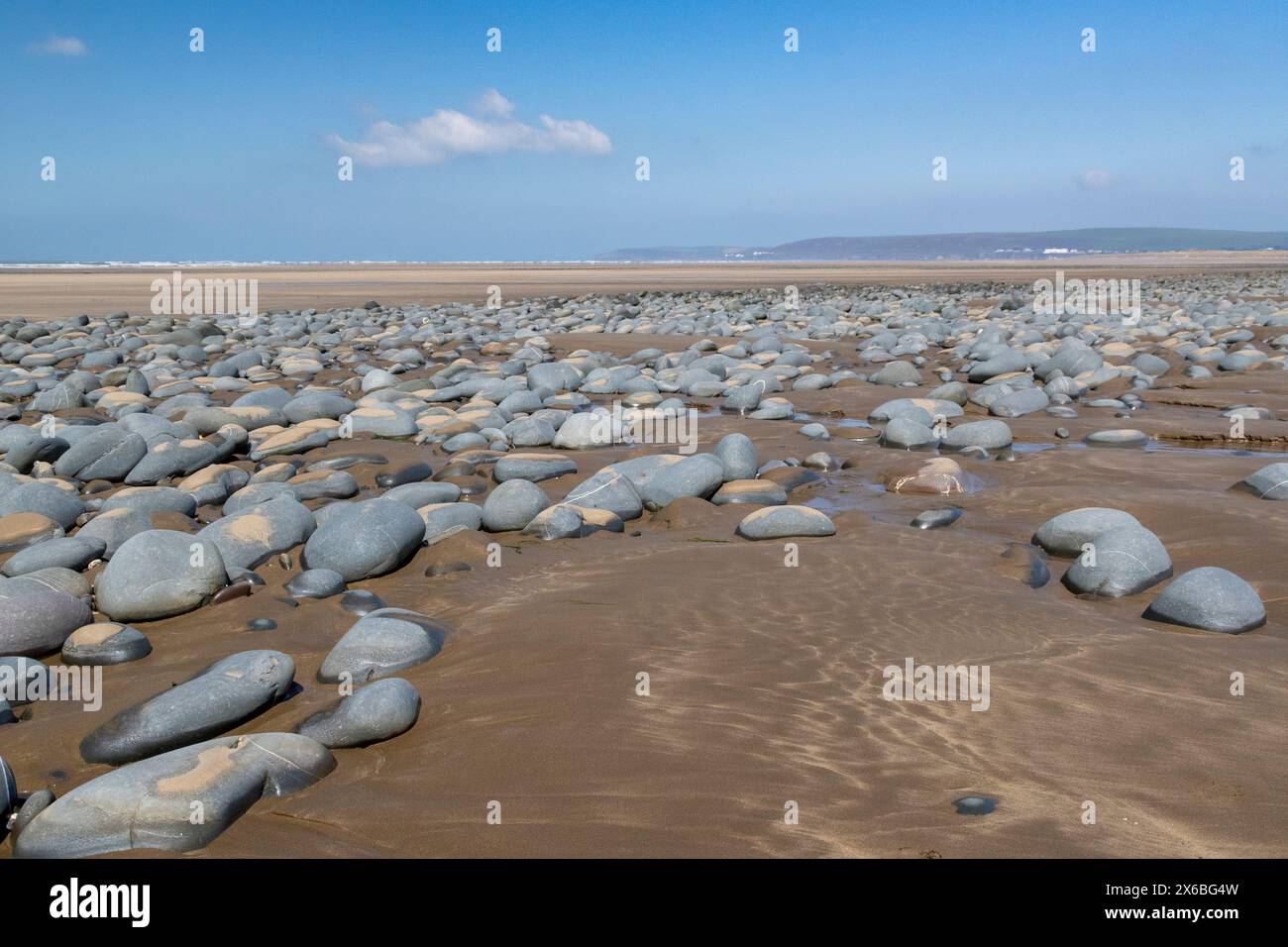 Late Summer, Pebble and Beach View Looking Across Northam Beach & Taw Torridge Estuary To Saunton Sands with Blue Sky and Clouds #4. Stock Photo