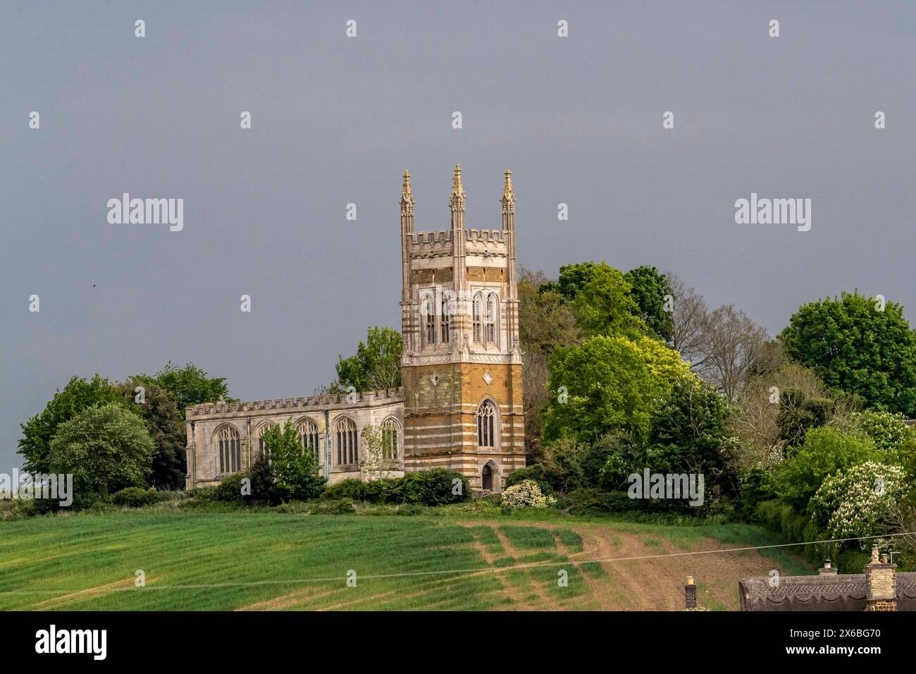 The church of ST. MARY THE VIRGIN stands on Combe Hill, above the village of Whiston