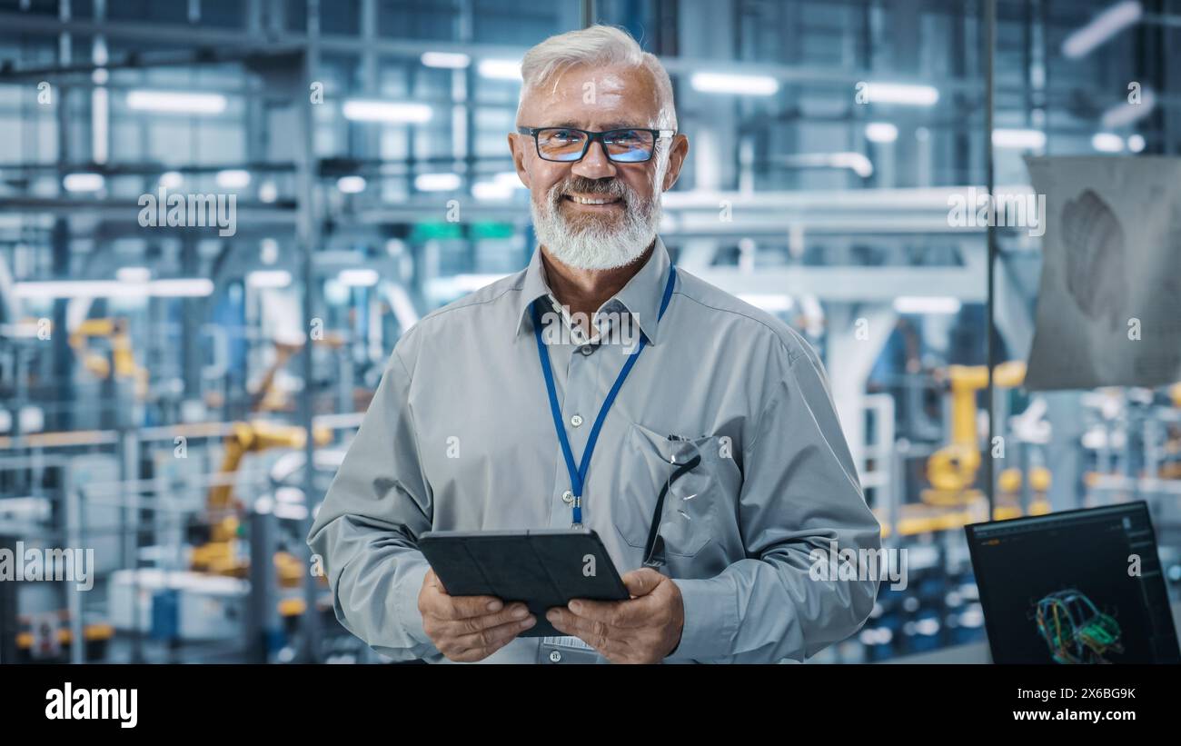 Car Factory Office: Portrait of Senior White Male Chief Engineer Using ...