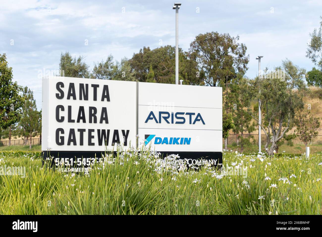 A directory sign with company logo signs (Arista and Daikin) at Santa Clara Gateway in Santa Clara, CA, USA. Stock Photo
