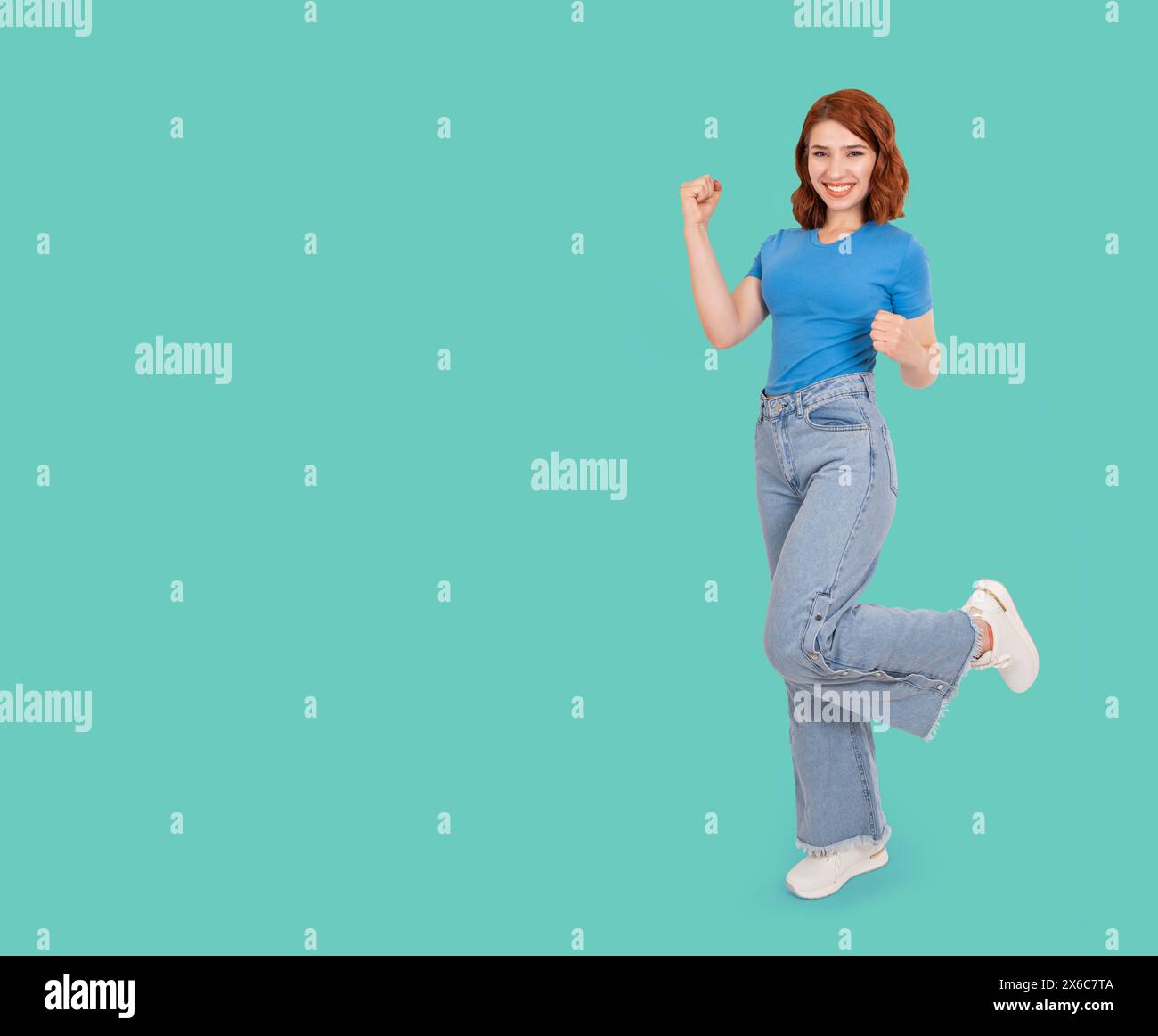 Full body view caucasian young red hair happy woman posing. Standing on