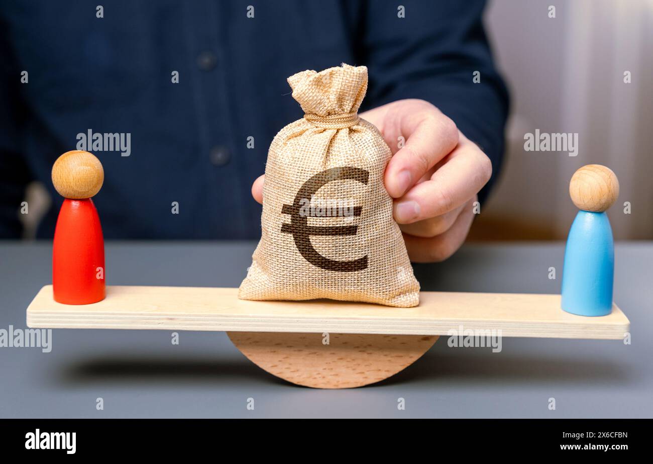 Legal dispute over money. A court case. Plaintiff and defendant on scales and a bag with euro money. Search for a compromise. Mediation of conflicting Stock Photo