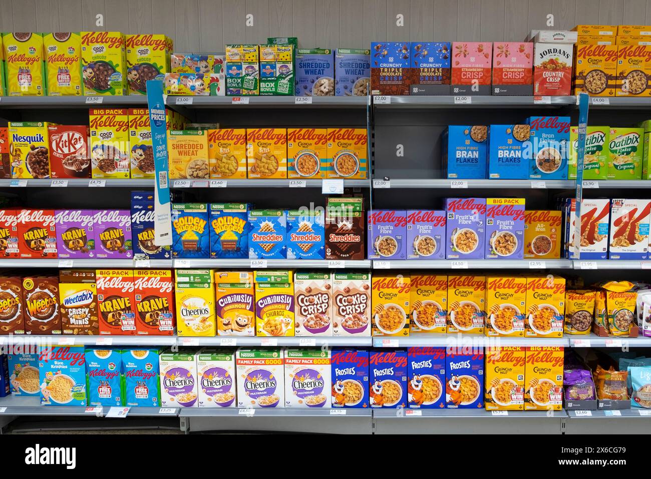 Rows of boxes of various brands of breakfast cereal on shelves in Co Op  CoOp CoOperative supermarket Great Britain UK   KATHY DEWITT Stock Photo