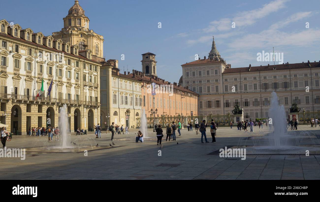 Piazza Castello in Turin, Italy, with the Royal Palace, San Lorenzo church and the dome of the San Giovanni Cathedral Stock Photo