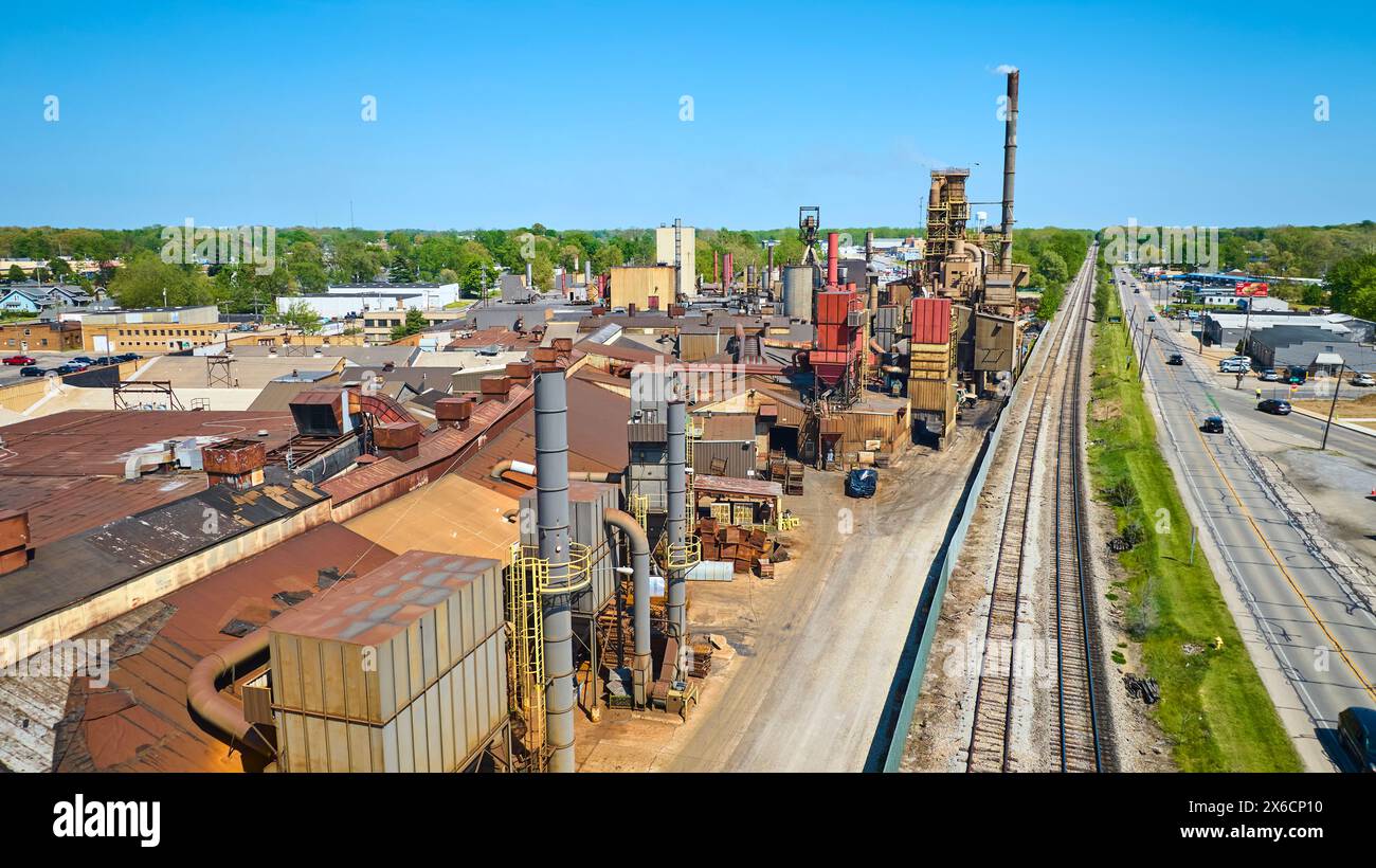 Aerial of Industrial Complex with Smokestacks, Transport Links, Warsaw, Indiana Stock Photo