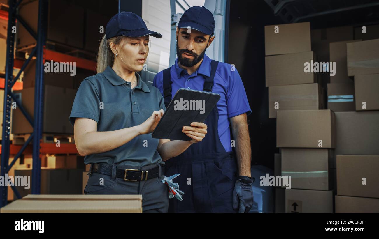 Outside of Logistics Distributions Warehouse With Inventory Manager Using Tablet Computer, talking to Worker Loading Delivery Truck with Cardboard Boxes. Online Orders, Purchases, E-Commerce Goods Stock Photo