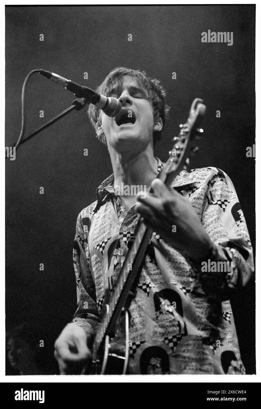 CRISPIN HUNT, LONGPIGS, 1996: Crispin Hunt of Longpigs playing live at Newport Centre in Newport, Wales, UK on 2 June 1996. Photo: Rob Watkins.  INFO: Longpigs, a British alternative rock band formed in Sheffield in 1994, gained recognition with their debut album 'The Sun Is Often Out.' Hits like 'She Said' showcased their melodic sound and poignant lyrics, earning them a devoted following in the '90s music scene. Stock Photo
