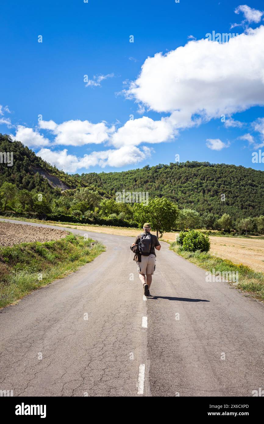 Male hiker walking on road hi-res stock photography and images - Alamy