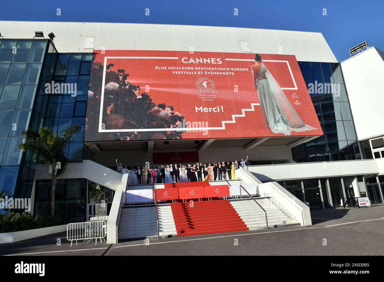 France, french riviera, Cannes, the festival palace with its famous red carpet and the poster to promate the organization of festivals and fairs. Stock Photo