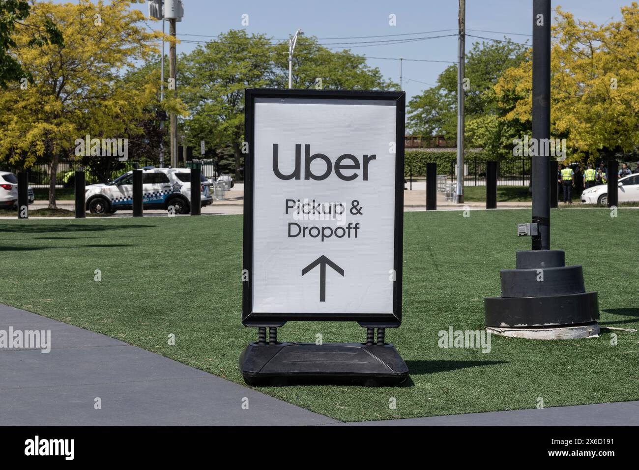 Chicago - May 12, 2024: Uber pickup and dropoff point sign. Uber and Lyft have replaced many Taxi cabs for transportation with a smart phone app. Stock Photo