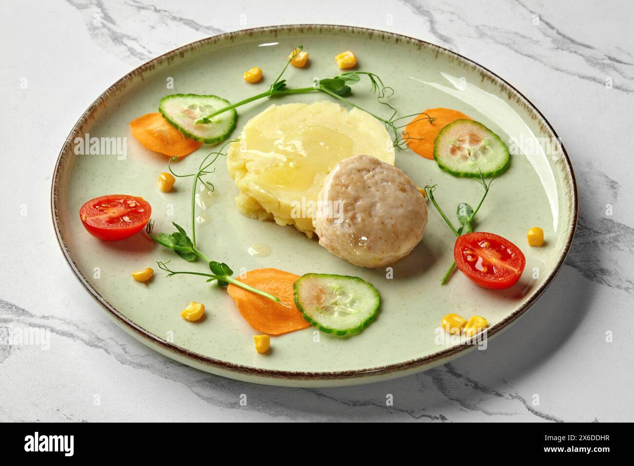 Steamed fish patty with mashed potatoes for kids Stock Photo - Alamy