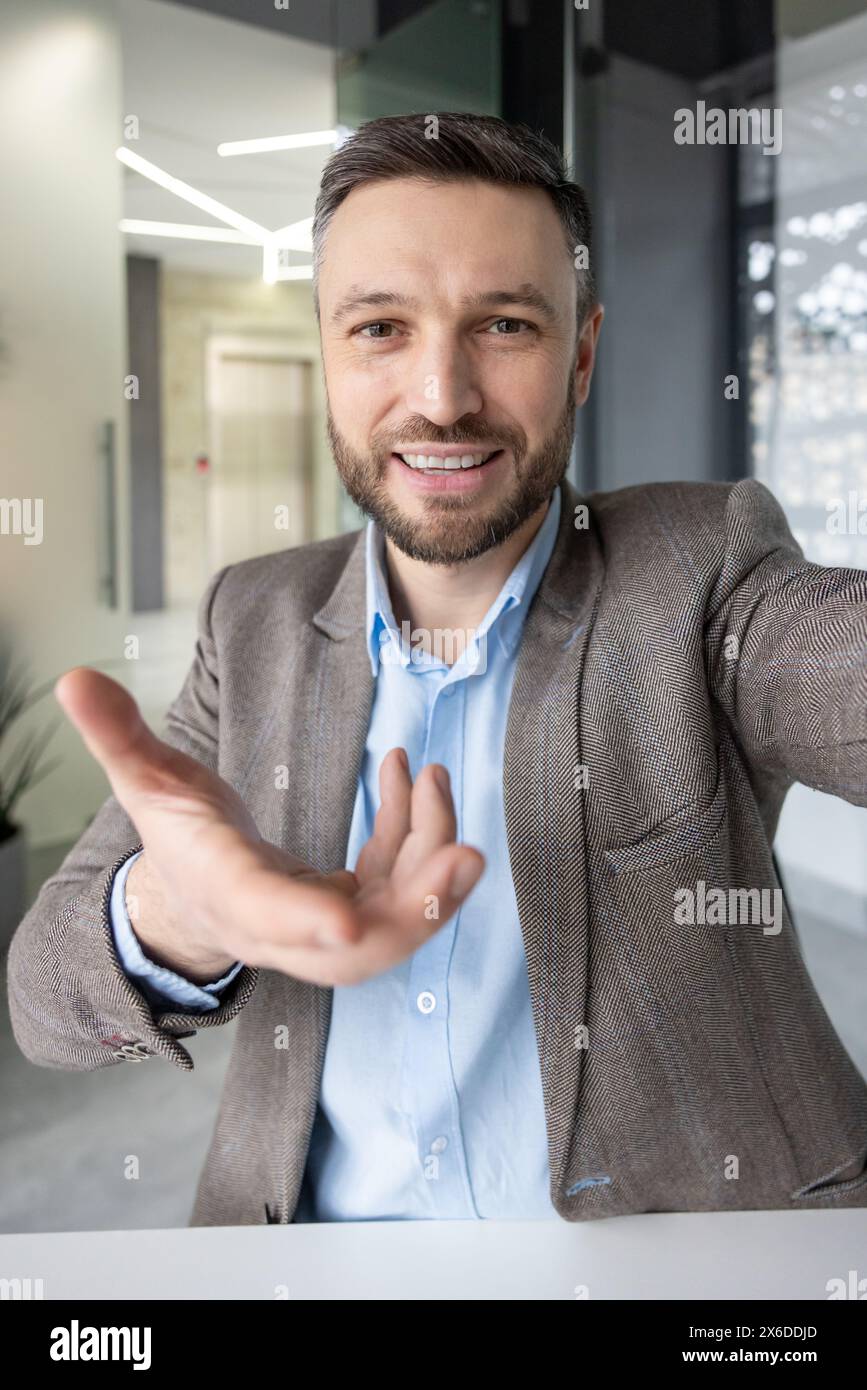 Vertical video man reaching hand hi-res stock photography and images ...