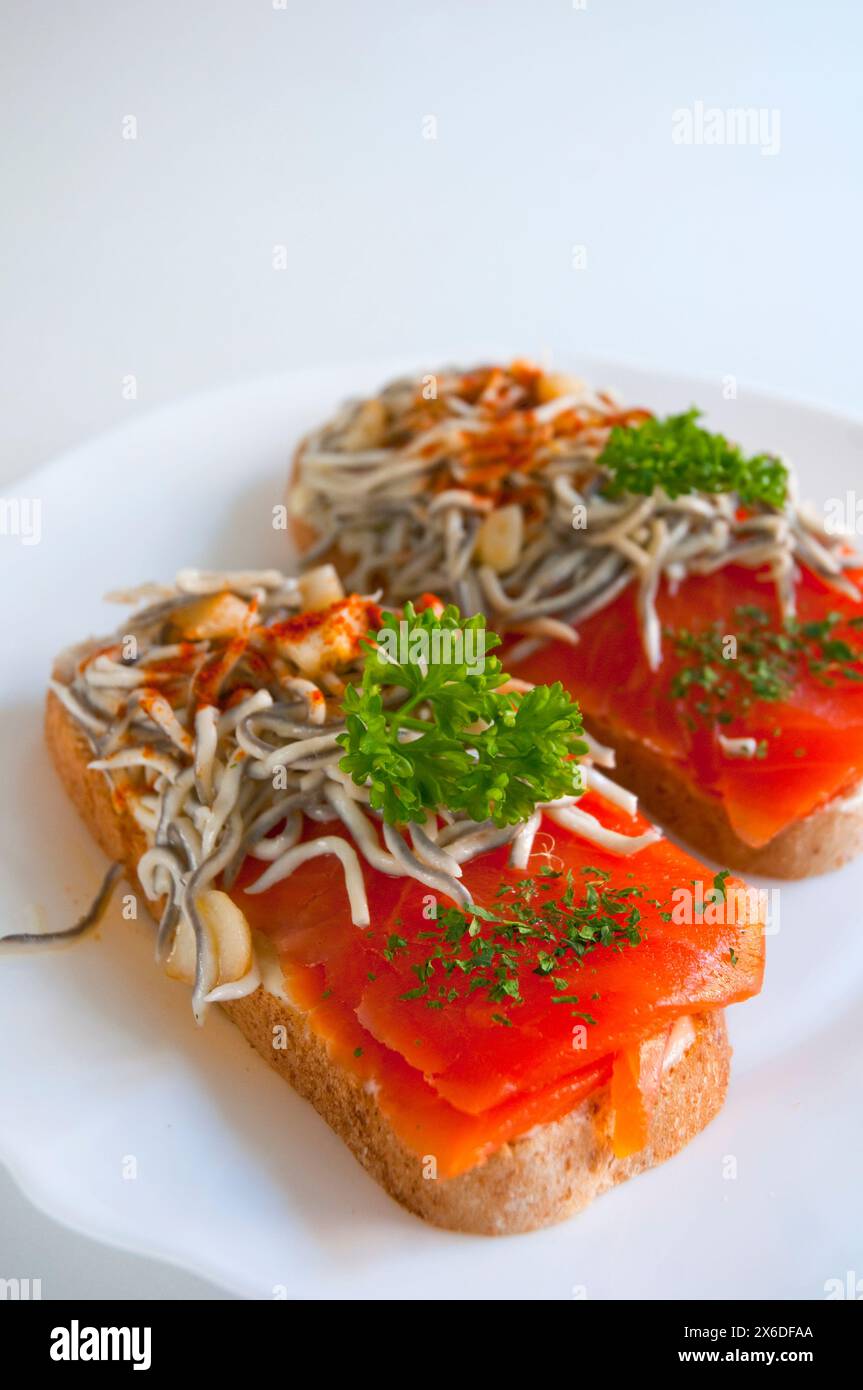 Spanish Tapa: Toast With Smoked Salmon And Eels. Close View Stock Photo ...