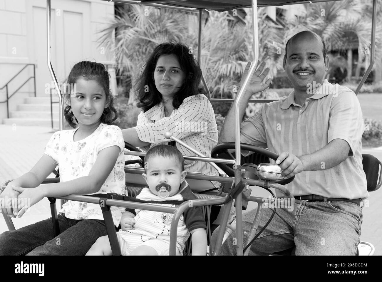 Tourists enjoying a ride on family car type bikes at Virginia Beach on ...