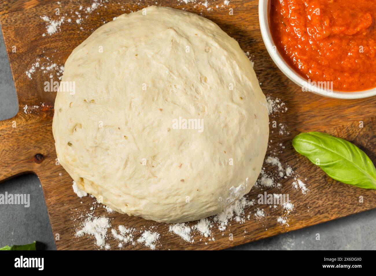 Round White PIzza Dough with Flour Ready to Bake Stock Photo