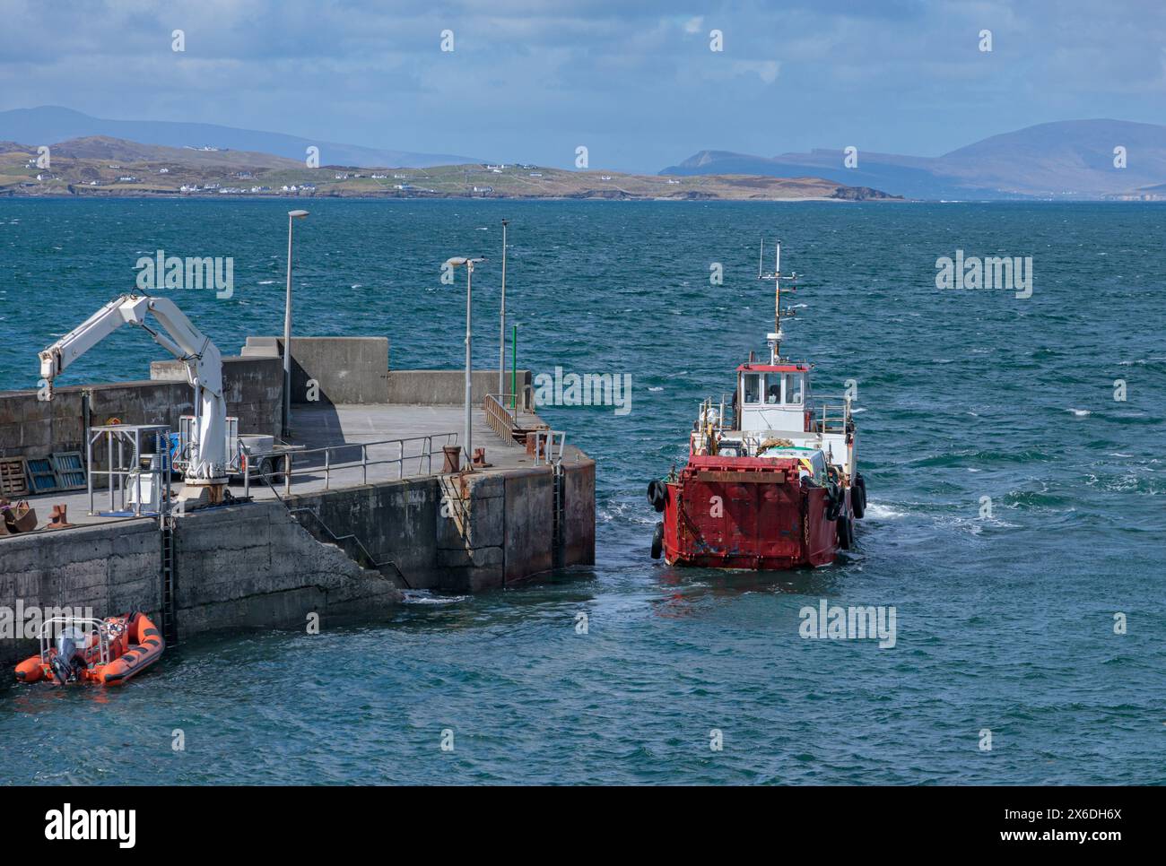 Ferry with a van onboard setting out to sea from Roonagh to Clare Island Stock Photo