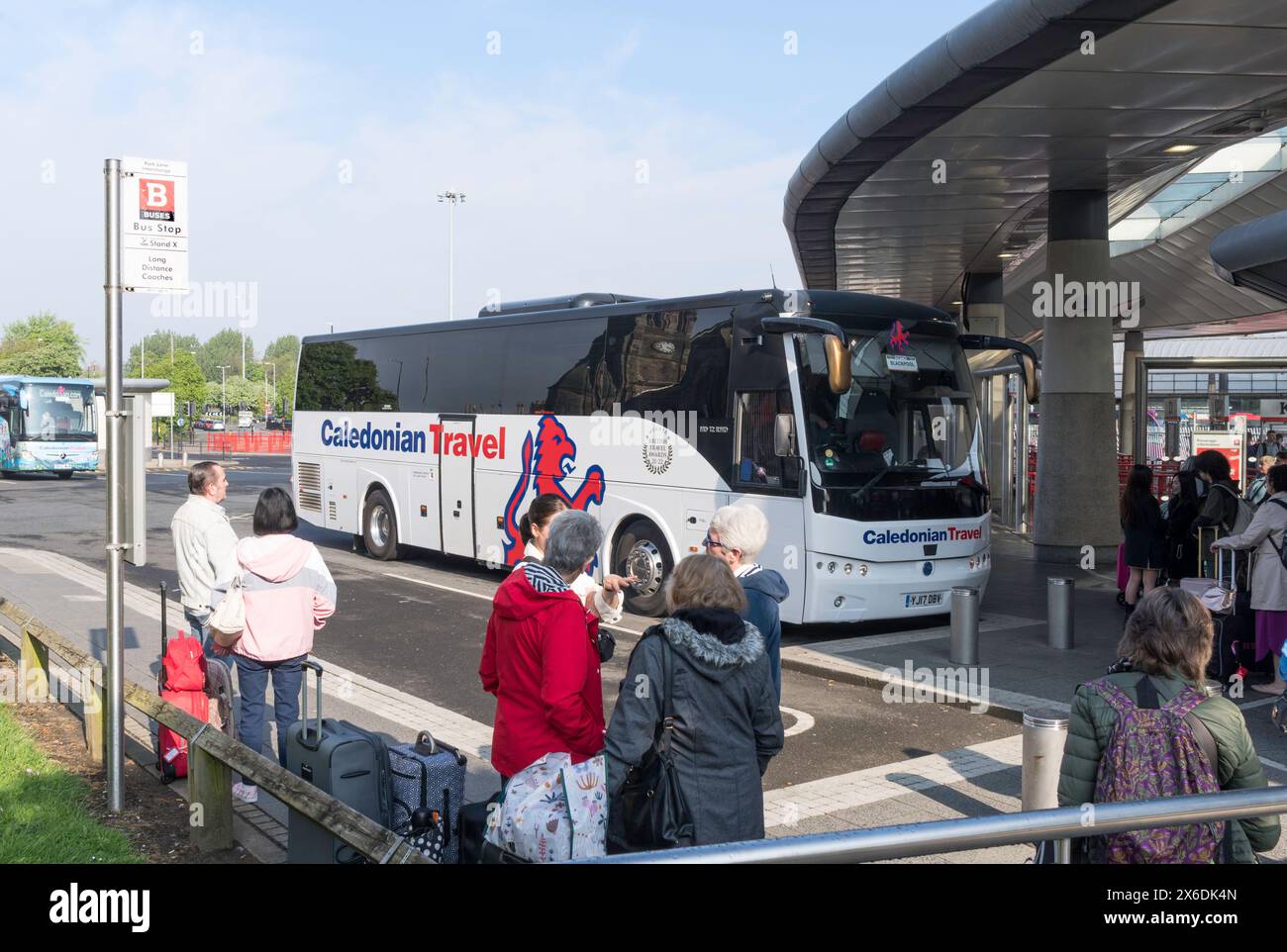 Passengers waiting to board coaches at Sunderland bus station, England, UK Stock Photo