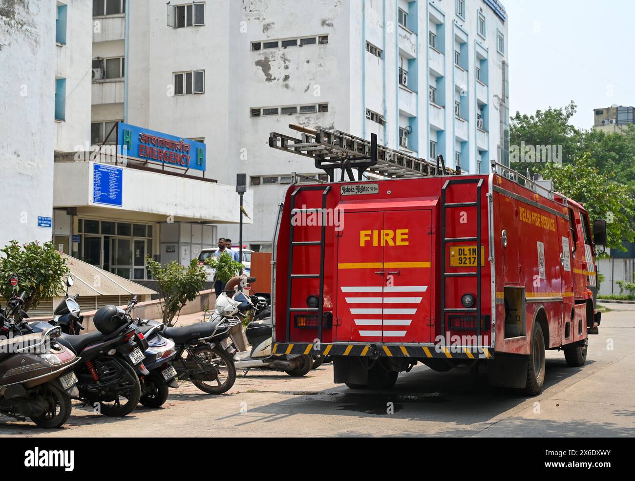 NEW DELHI, INDIA - MAY 14: Vehicles of Fire Department and Delhi Police seen parked as Bomb Squad from Delhi Police carries out search operation inside Deep Chand Bandhu Hospital as the reportedly after a bomb threat was received in the early hours of morning at Ashok Vihar on May 14, 2024 in New Delhi, India. Four Delhi hospitals, including Deepchand Bandhu Hospital, Dada Dev Hospital, Hedgewar Hospital and Guru Teg Bahadur (GTB) Hospital, received bomb threat emails on Tuesday, two days after similar messages were sent to 20 hospitals, the airport and the office of the Northern Railways' CPR Stock Photo