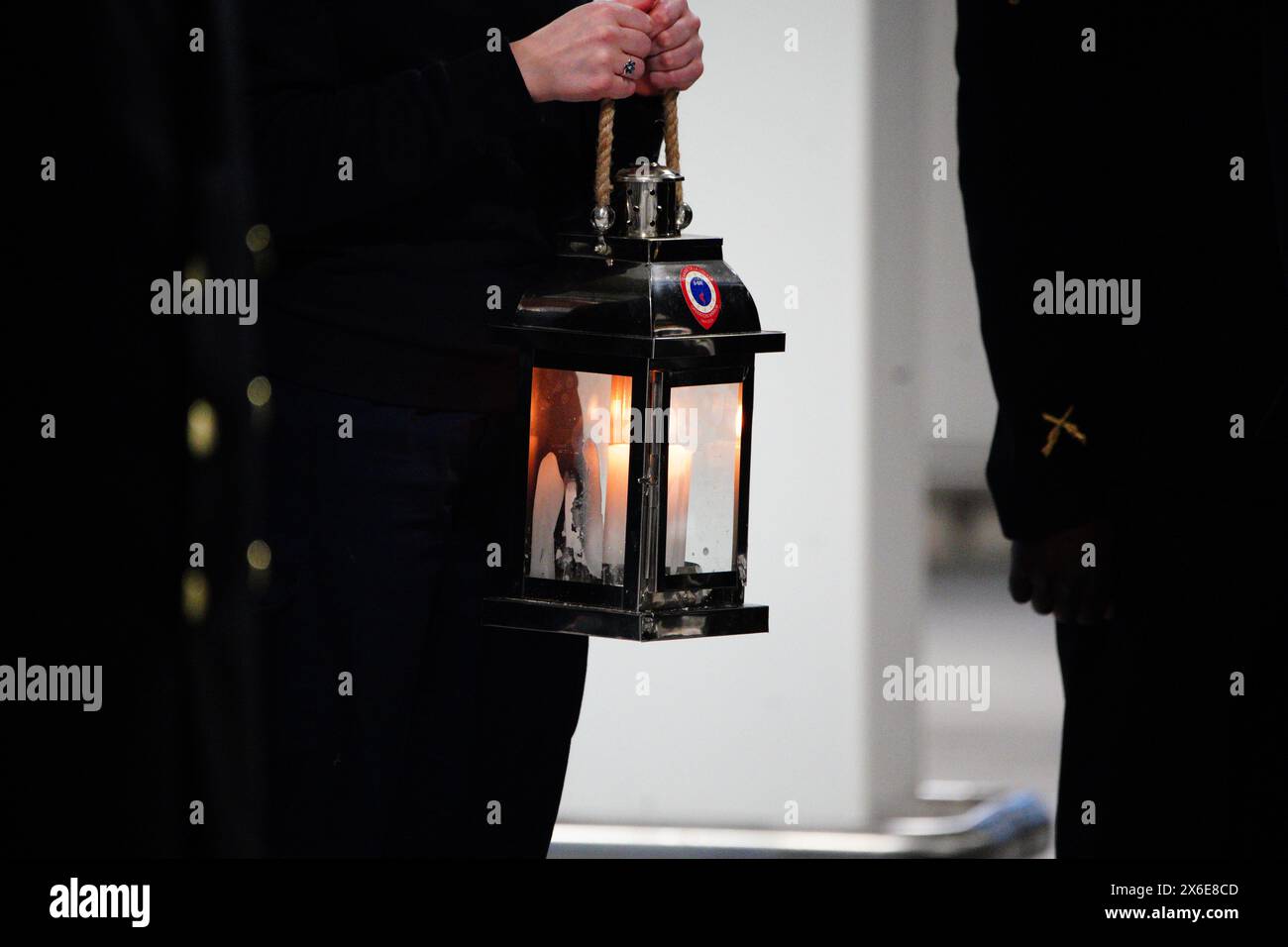 France's Freedom Flame is carried during a ceremony at Portsmouth International Port. The Flamme de la Liberte, which normally resides under Paris' Arc de Triomphe, was brought by ferry to Portsmouth before departing for Arlington, Virginia, USA. The move is to pay thanks to the UK and USA as part of D-Day 80th anniversary commemorations. Picture date: Tuesday May 14, 2024. Stock Photo